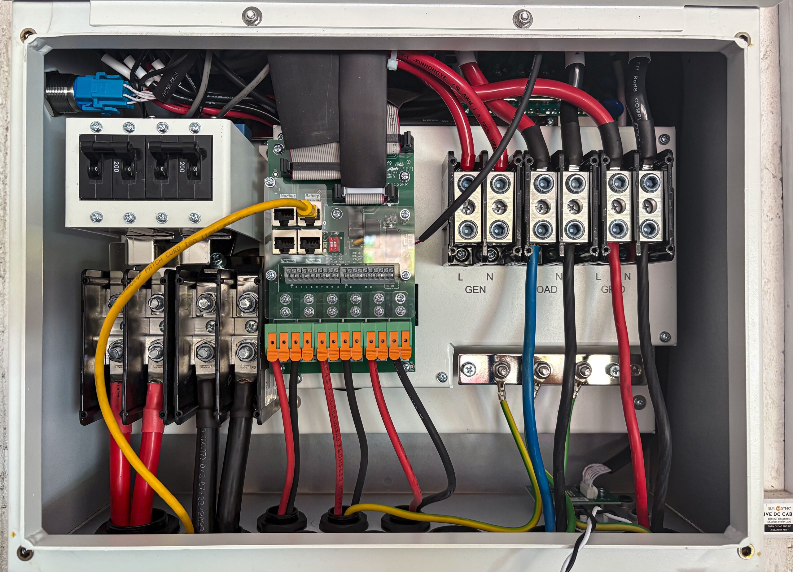 Home Inside view of an electrical control panel showing circuits and connections.